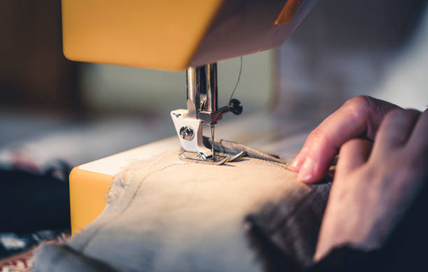 istock woman making and cutting for machine sewing garments 1226045592