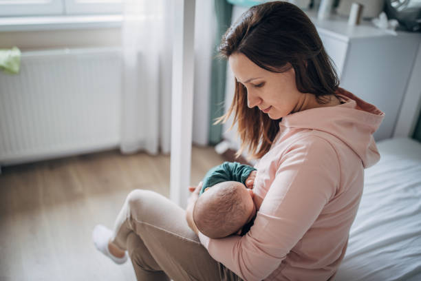 istock Mother breastfeeding her baby son at home 1226050428