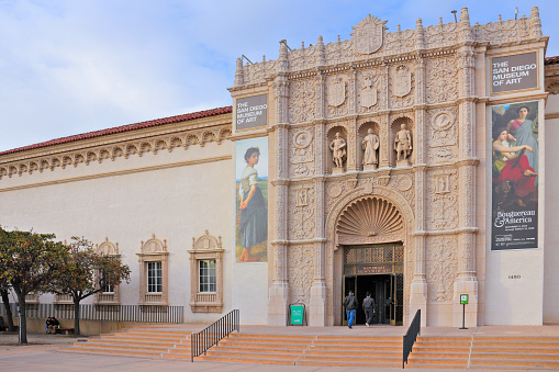 San Diego, USA - December 30, 2019:  day time view of the entrance for the San Diego museum of art located in Balboa Park. Designed by architects Johnson & Snyder, the museum opened in 1926. The museum’s Spanish style facade harmonizes with other structures in Balboa Park. It attracts 500,000 visitors yearly.