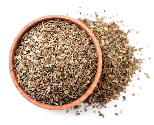 istock Dry basil in a plate on a white background, isolated. The view from top 1226053251