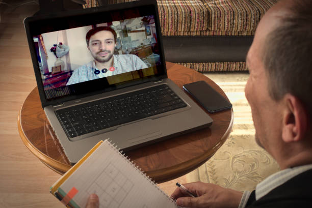 istock Two intelligent men working from home video chats about business with laptop 1226054267