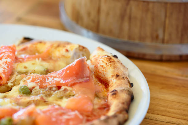 istock Homemade pizza with capers on a wood table 1226054849