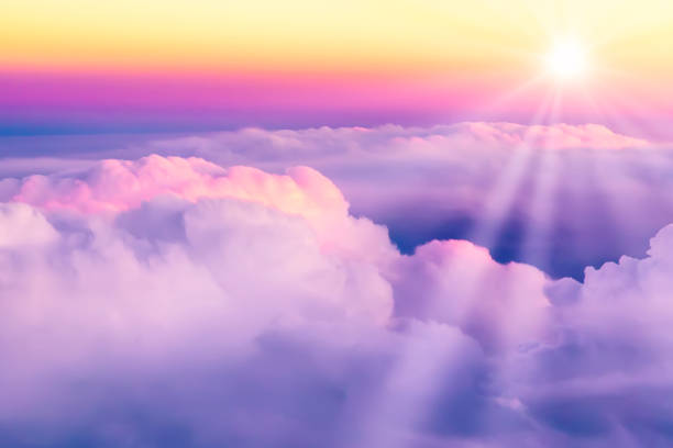 istock Beautiful sunset sky above clouds. View from airplane window 1226058297
