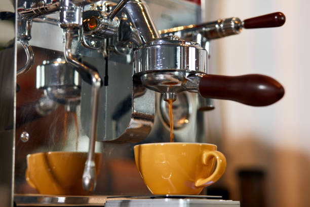 istock Skillful male barista working hard at counter 1226060746