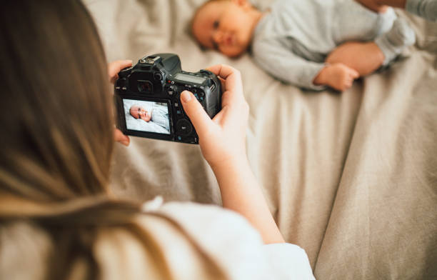 istock Mother breastfeeds and plays with her newborn baby 1226060963