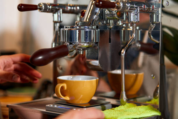 istock Skillful male barista working hard at counter 1226061117