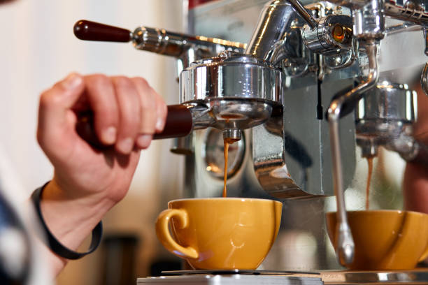 istock Skillful male barista working hard at counter 1226061268