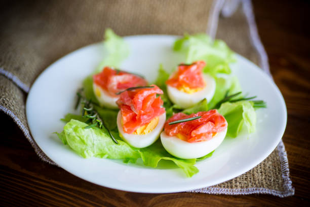 istock boiled eggs with salted red fish and salad leaves 1226062605