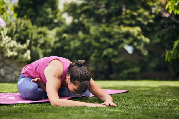 istock Woman doing yoga in her backyard. 1226062709