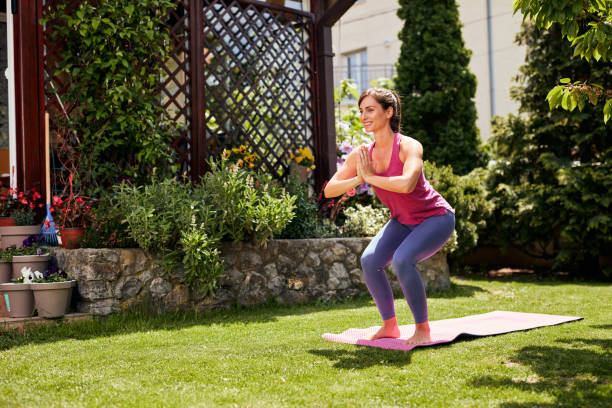 istock Woman doing yoga in her backyard. 1226062718