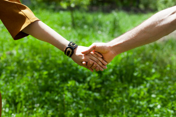 istock couple hand in hand  in garden 1226062886