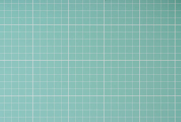 istock Green cutting mat closeup texture showing grid 1226064328