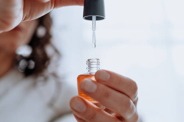 istock Woman polishing her nails at home 1226065162
