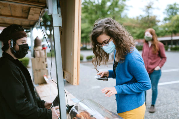 istock Masked Customer Orders Coffee And Snacks at Food Truck 1226065454