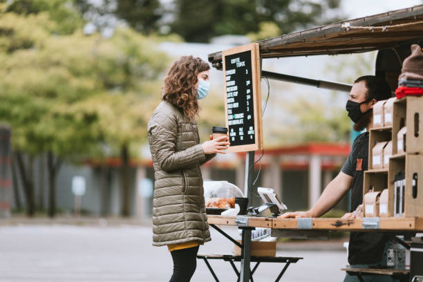 istock Masked Customer Orders Coffee And Snacks at Food Truck 1226065548