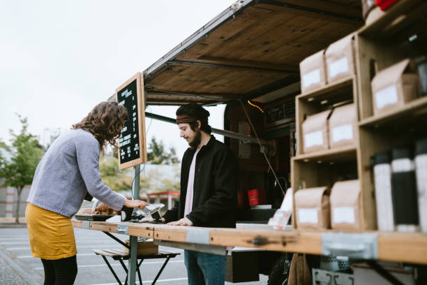 istock Mobile Coffee Truck Employee Takes Customers Order 1226065572
