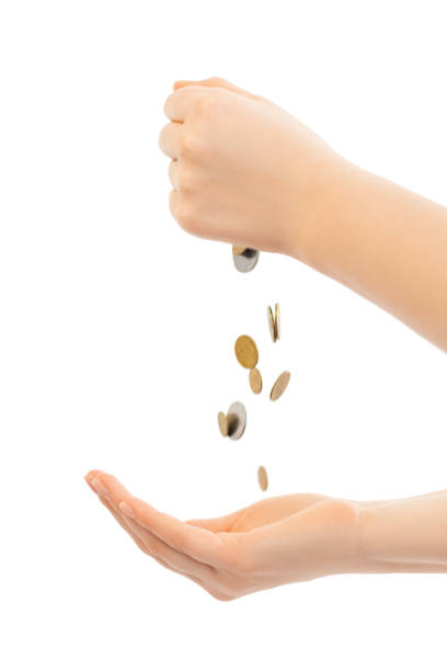 istock Coins are transferred from one hand to the other 1226067022