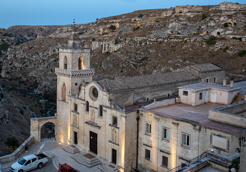 Matera, Italy - September 15, 2019: Church of San Pietro caveoso and on the top of the hill of Church of Saint Mary of Idris in Matera, Basilicata, Italy