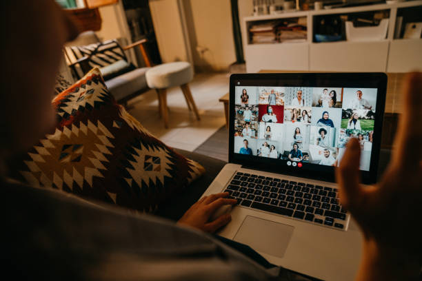 istock Young woman using a laptop on the sofa at home to have a work conference call 1226068264