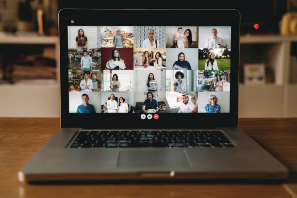 istock Laptop PC with many people having a meeting at distance 1226068276