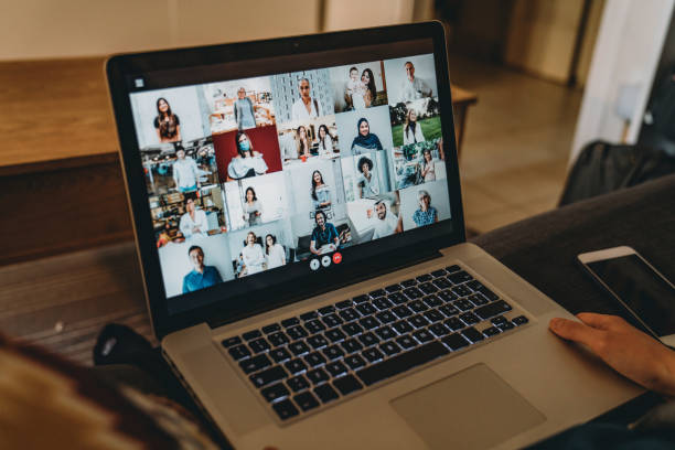 istock Young woman using a laptop on the sofa at home to have a work conference call 1226068282
