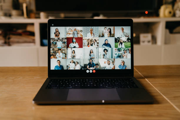 istock Laptop PC with many people having a meeting at distance 1226068292