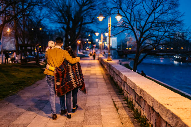 istock Couple with dog enjoying a walk in the park 1226069936