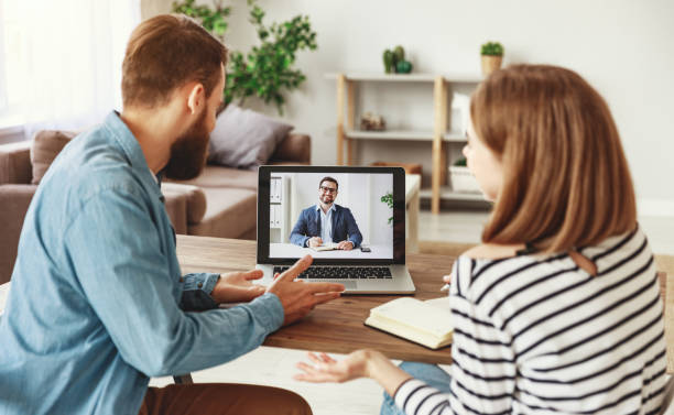 istock Couple making video call to financial counselor 1226072419