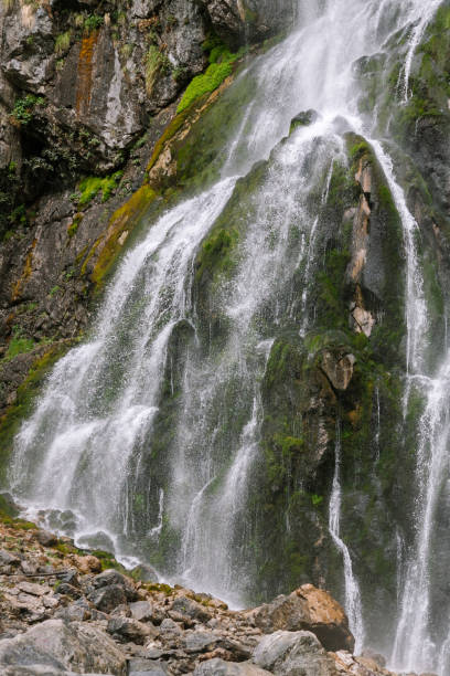 istock A mountain waterfall. A strong stream of water dropping down among rocks 1226072481