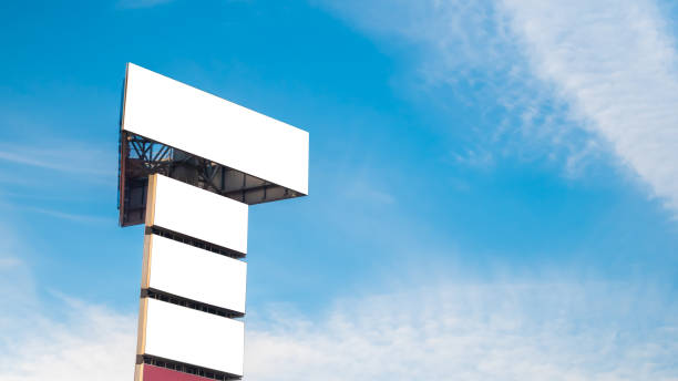 istock Mock up image: four blank white billboards and white clouds against blue sky 1226073718