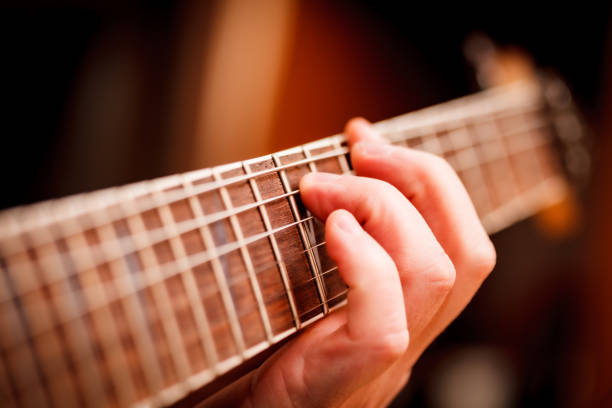 istock Man Playing Guitar on a Stage. Musical Concert 1226075227