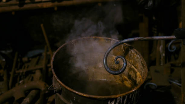 istock Blacksmith quenching hot iron part of forged gate 1226075349