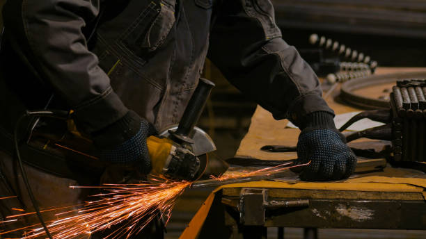 istock Blacksmith sawing metal with hand circular saw 1226075922