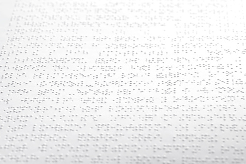 A training book with Braille text.