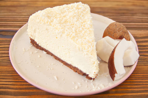 delicious cheesecake with coconut on  plate stock photo