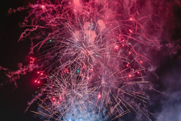 istock Red firework with smoke over the city sky 1226080279