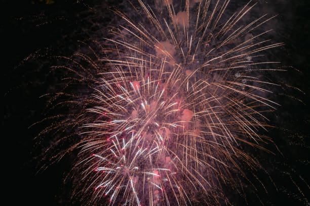 istock Red firework with smoke over the city sky 1226080289