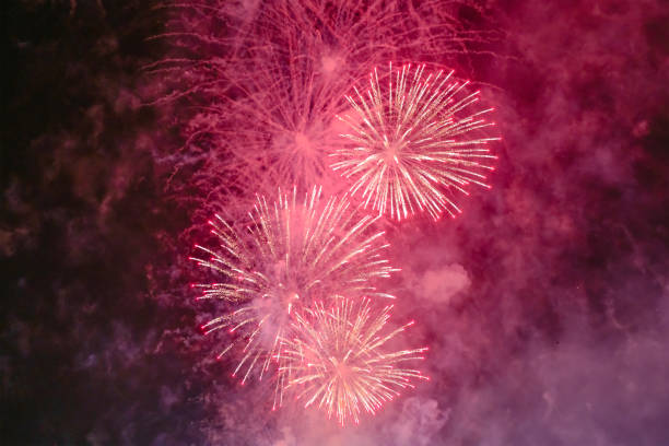 istock Red firework with smoke over the city sky 1226080411