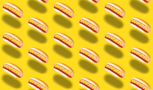 istock seamless pattern of hot dogs on yellow background 1226081370