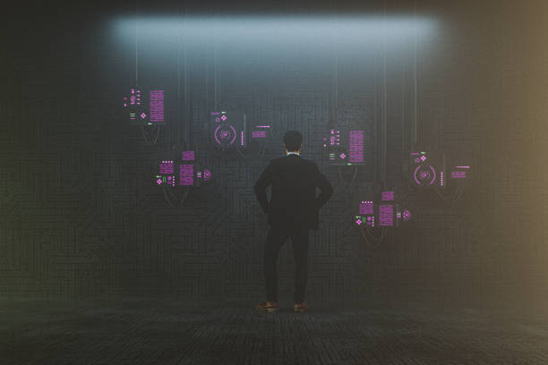 istock Futuristic man in front of suspended computer monitors 1226082331