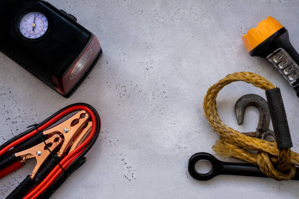 istock led light, tow rope and lighting wires, auxiliary start-up frost-resistant and compressor for pumping tires. 1226082494