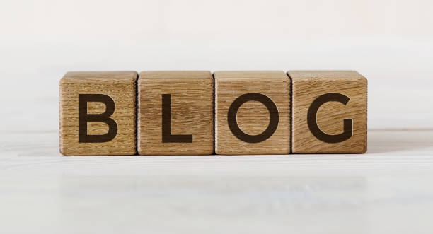 istock Wooden blocks with word BLOG on a light table and light background 1226082613