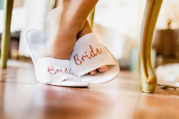 Wedding day slippers on bride
