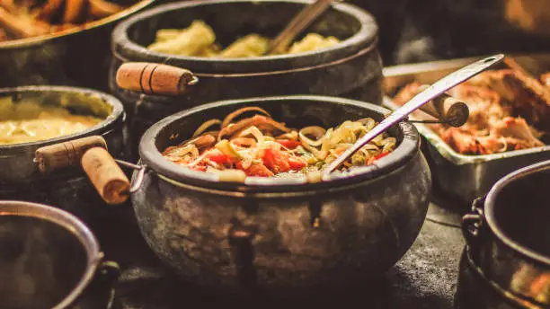 Traditional Brazilian food made in iron pan.