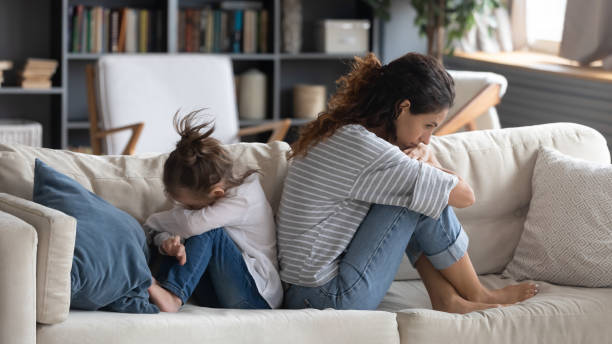 istock Young mom and daughter avoid talking after fight 1226087871