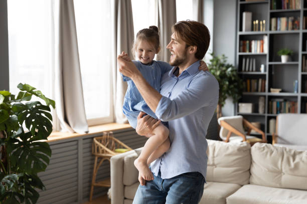 istock Happy young dad dancing with cute little daughter 1226087886