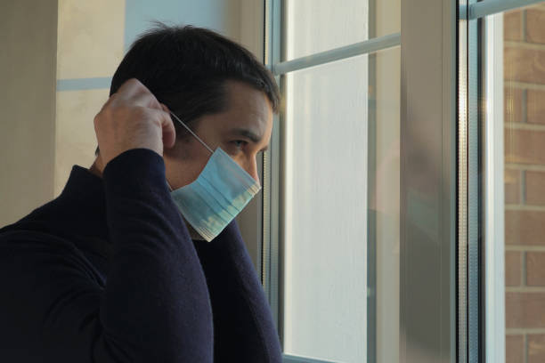 istock Man goes for a walk in a medical mask 1226088179
