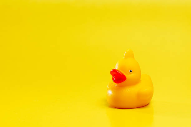 istock yellow rubber duck for bathing on yellow background 1226089426
