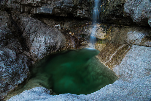 A beautiful, little water puddle filled by a waterfall, location near Moggio Udinese (UD), FVG, Italy.