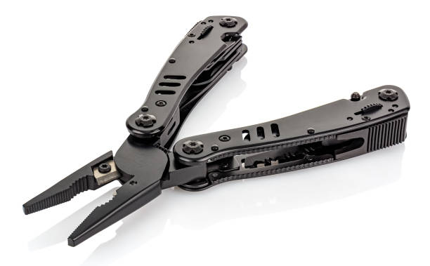 istock Open pliers of black multi tool knife isolated on white background with reflection on glossy surface. Multipurpose knife close-up image 1226092839